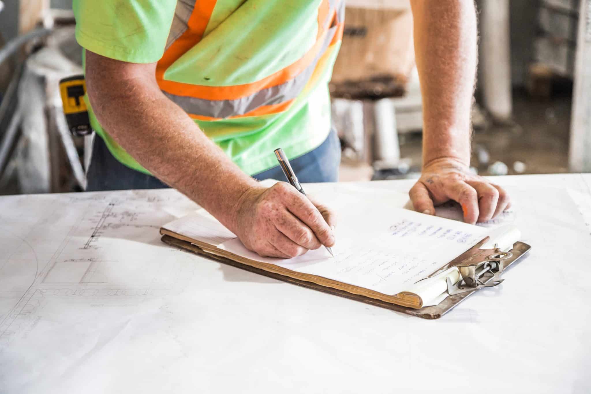 maintenance person planning with a clipboard maintenance person planning with a clipboard